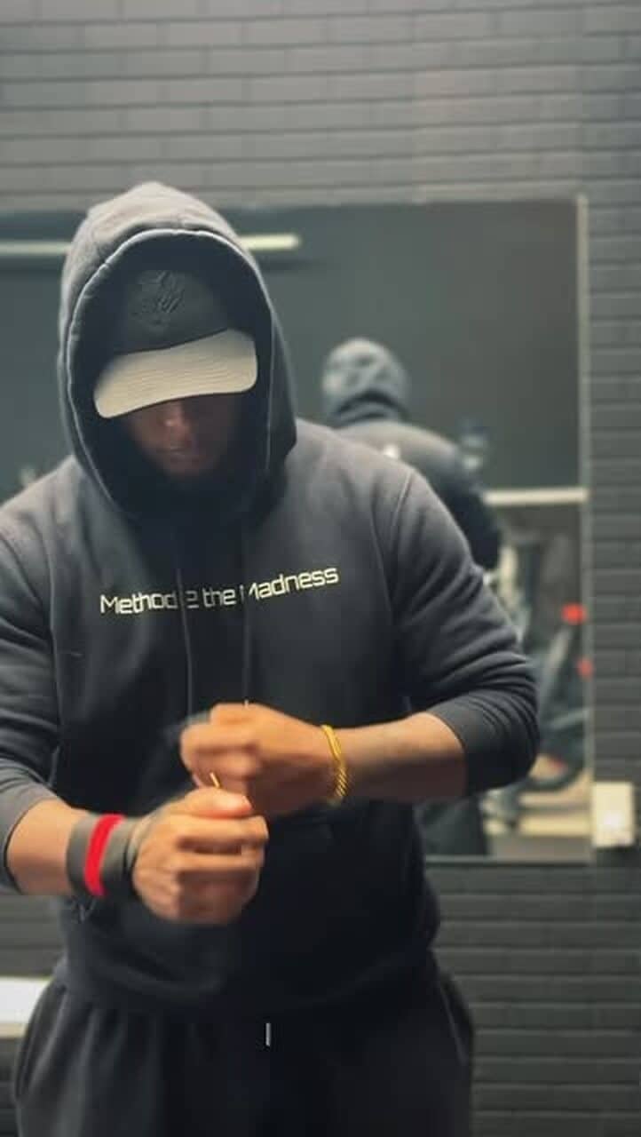 Coach wrapping his wrists before a session at the Beamsville studio