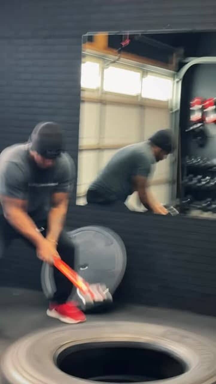 Sledgehammer work on a tractor tire during a conditioning round